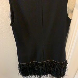 Black dress with ostrich feathers on bottom